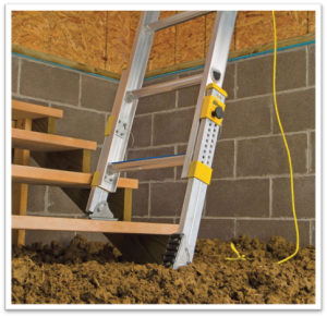 Ladder on stairs, with leveler on lower leg to make it level.