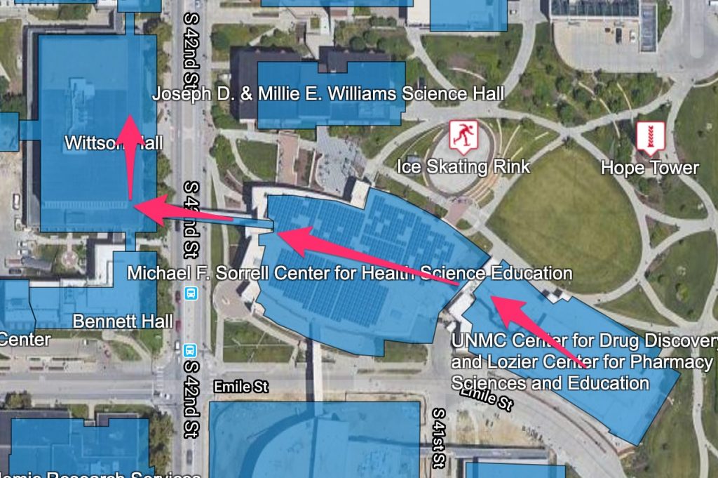 Arrows on the campus map show the path from the COP building to the McGoogan Library.